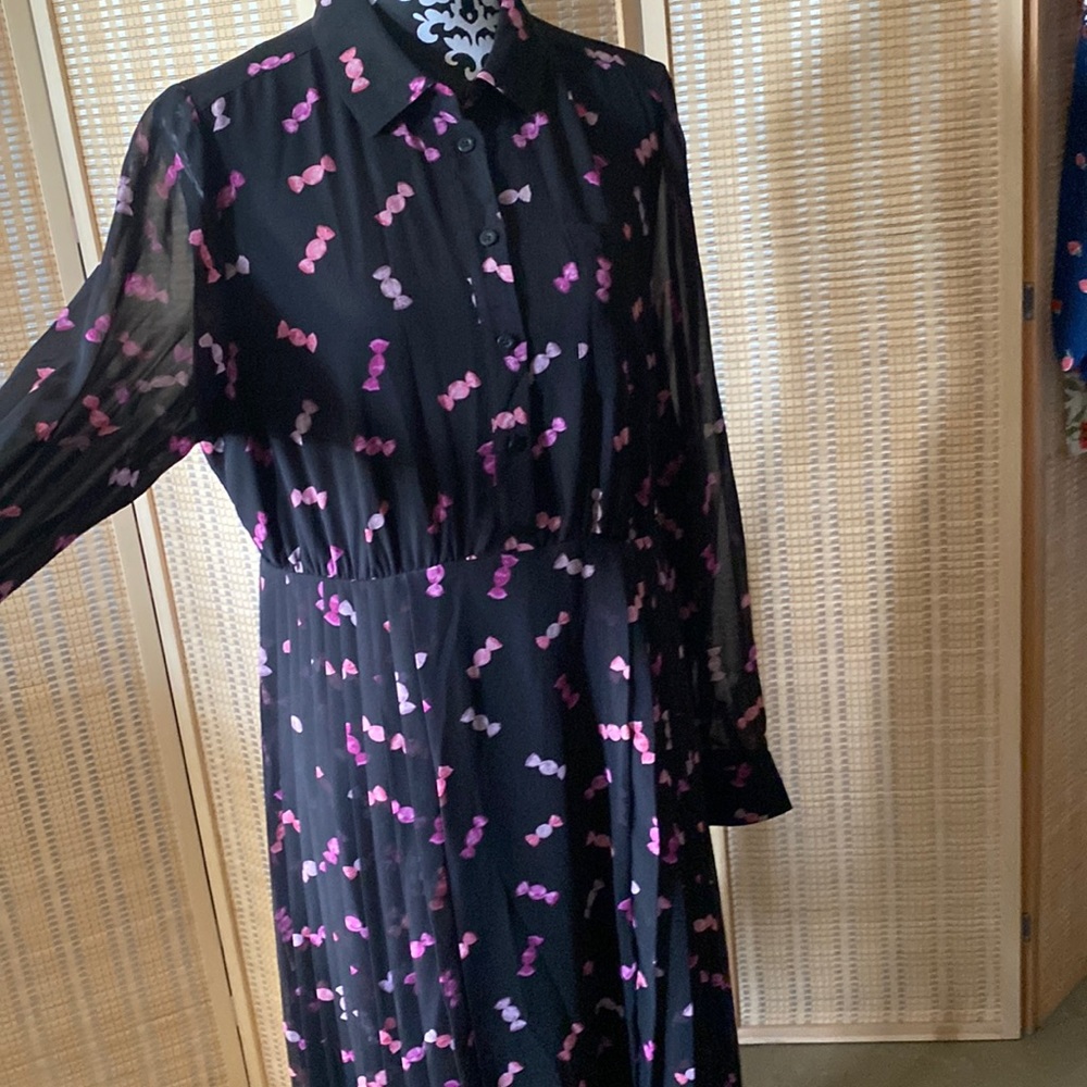 Knee length, flowing pleated dress